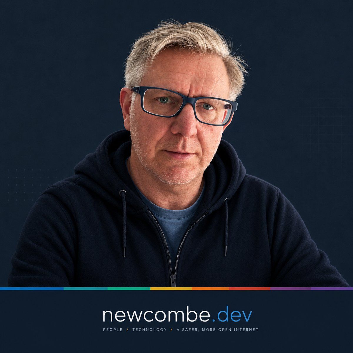 Pete Newcombe, wearing glasses and a navy hoodie, above a newcombe.dev banner with a seven-colour spectrum line.